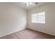 This bedroom has a ceiling fan and window, perfect for creating a relaxing space at 2210 N 27Th Pl, Phoenix, AZ 85008