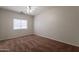 This bedroom has a ceiling fan and window, perfect for creating a relaxing space at 2210 N 27Th Pl, Phoenix, AZ 85008