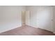 This bedroom features neutral walls and flooring, with a closet for storage at 2210 N 27Th Pl, Phoenix, AZ 85008