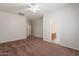 This bedroom has an ensuite bathroom and is bathed in natural light with a ceiling fan at 2210 N 27Th Pl, Phoenix, AZ 85008