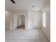Spacious living room with tiled floors and a view into another room at 2210 N 27Th Pl, Phoenix, AZ 85008
