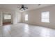 Bright, open-concept living room with tile flooring and multiple windows at 2210 N 27Th Pl, Phoenix, AZ 85008