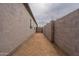 Paved side yard features secure block wall, privacy, and convenient gated access at 2210 N 27Th Pl, Phoenix, AZ 85008