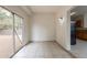 Bright sun room with tiled floors and sliding glass door leading to the backyard at 2210 N 27Th Pl, Phoenix, AZ 85008