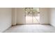 Sun-filled room with tile flooring and sliding glass door to the backyard at 2210 N 27Th Pl, Phoenix, AZ 85008