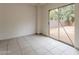 Bright sunroom features tile flooring and sliding glass doors to private backyard at 2210 N 27Th Pl, Phoenix, AZ 85008