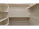 Spacious walk-in closet with shelving and wooden rods at 2210 N 27Th Pl, Phoenix, AZ 85008