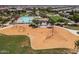 Great community area with pool, playground, covered seating, and nearby residences at 23097 E Camina Buena Vis, Queen Creek, AZ 85142