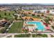 Spacious community area offering a pool, playground, and grassy spaces for recreation at 23097 E Camina Buena Vis, Queen Creek, AZ 85142