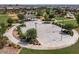Overhead shot of the community basketball court, adjacent to grassy green spaces and the pool at 23097 E Camina Buena Vis, Queen Creek, AZ 85142