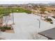 Well-maintained community basketball court with multiple hoops and seating at 23097 E Camina Buena Vis, Queen Creek, AZ 85142