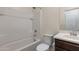 A bathroom featuring a tub and shower combination, a white vanity, and a comfort-height toilet at 23097 E Camina Buena Vis, Queen Creek, AZ 85142