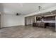 Open living area with a kitchen featuring an island with pendant lighting and stainless steel appliances at 23097 E Camina Buena Vis, Queen Creek, AZ 85142
