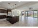 A spacious open-concept kitchen with a large island and stainless steel appliances overlooks the outdoor living area at 23097 E Camina Buena Vis, Queen Creek, AZ 85142