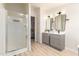 Bright bathroom featuring dual vanity, shower, and modern fixtures at 231 N 88Th Way, Mesa, AZ 85207
