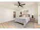 Serene bedroom featuring neutral tones, wood floors, and ample natural light at 231 N 88Th Way, Mesa, AZ 85207