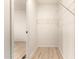 Walk-in closet with wire shelving and light wood floors at 231 N 88Th Way, Mesa, AZ 85207