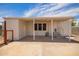 A covered patio with stairs and string lights, offers an outdoor living space at 231 N 88Th Way, Mesa, AZ 85207