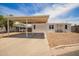 Charming single-story home featuring a covered carport and a low-maintenance desert landscape at 231 N 88Th Way, Mesa, AZ 85207