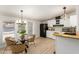 Charming kitchen and breakfast nook with stylish lighting and a bright, airy feel at 231 N 88Th Way, Mesa, AZ 85207