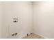 Utility room with hookups and neutral flooring, ready for washer and dryer at 231 N 88Th Way, Mesa, AZ 85207