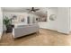 Bright living room with tile flooring, neutral decor, and a view into the dining area at 231 N 88Th Way, Mesa, AZ 85207