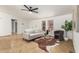 Stylish living room featuring tile floors, neutral decor, and a modern ceiling fan at 231 N 88Th Way, Mesa, AZ 85207