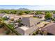Overhead shot of a residential neighborhood featuring an upscale home with a pool and basketball court at 23465 S 202Nd St, Queen Creek, AZ 85142