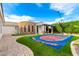Backyard features a basketball court with a seating area and putting green at 23465 S 202Nd St, Queen Creek, AZ 85142