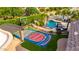 Aerial view of a custom backyard basketball court, poolside lounge area, and beautifully landscaped yard at 23465 S 202Nd St, Queen Creek, AZ 85142