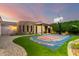 Beautiful home with a custom basketball court, pergola, and well-maintained landscaping, perfect for outdoor activities at 23465 S 202Nd St, Queen Creek, AZ 85142