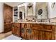 This bathroom features and sinks, granite counters and wooden cabinets at 23465 S 202Nd St, Queen Creek, AZ 85142