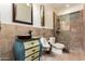 Bathroom featuring tiled walls, uniquely designed sink with copper basin and glass enclosed shower at 23465 S 202Nd St, Queen Creek, AZ 85142