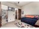 This bedroom features light colored walls, carpeted floor, and multiple wood doors at 23465 S 202Nd St, Queen Creek, AZ 85142