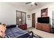 This bedroom has light colored walls, carpeted floor, and a ceiling fan at 23465 S 202Nd St, Queen Creek, AZ 85142