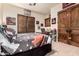 Comfortable bedroom with sports-themed decor and natural light, perfect for relaxation at 23465 S 202Nd St, Queen Creek, AZ 85142