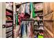 Organized walk-in closet with ample shelving, rods, and efficient storage solutions at 23465 S 202Nd St, Queen Creek, AZ 85142
