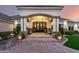 Elegant front entrance showcasing a grand chandelier, stone accents, and comfortable seating area at 23465 S 202Nd St, Queen Creek, AZ 85142
