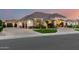 Charming home featuring an attached garage, manicured lawn, and a welcoming front entrance at 23465 S 202Nd St, Queen Creek, AZ 85142