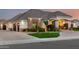 Charming home featuring an attached garage, manicured lawn, and a welcoming front entrance at 23465 S 202Nd St, Queen Creek, AZ 85142