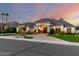 Beautiful home featuring manicured landscaping, a grand entrance, and tasteful exterior lighting at 23465 S 202Nd St, Queen Creek, AZ 85142