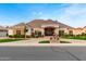 Beautiful home featuring stone accents, manicured landscaping, and a grand entrance under a clear sky at 23465 S 202Nd St, Queen Creek, AZ 85142