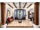 Elegant foyer with high ceilings, wood beams, tiled floors, and a decorative front door at 23465 S 202Nd St, Queen Creek, AZ 85142