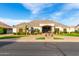 Attractive single-story home with desert landscaping, a paver driveway, and a welcoming covered porch at 23465 S 202Nd St, Queen Creek, AZ 85142