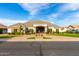 Attractive single-story home with desert landscaping, a paver driveway, and a welcoming covered porch at 23465 S 202Nd St, Queen Creek, AZ 85142