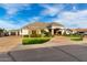Attractive single-story home with desert landscaping, a circular paver driveway, and a covered porch at 23465 S 202Nd St, Queen Creek, AZ 85142