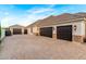 View of multiple car garage and stone driveway at 23465 S 202Nd St, Queen Creek, AZ 85142