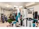 Garage with exercise equipment, golf cart and various storage solutions at 23465 S 202Nd St, Queen Creek, AZ 85142