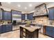 Well-equipped kitchen boasts stainless appliances, granite countertops, and custom cabinetry at 23465 S 202Nd St, Queen Creek, AZ 85142
