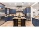 Well-equipped kitchen boasts stainless appliances, granite countertops, and custom cabinetry at 23465 S 202Nd St, Queen Creek, AZ 85142